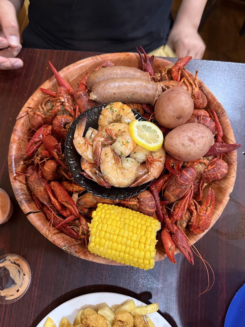 Boiled crawfish piled on a casual restaurant table.