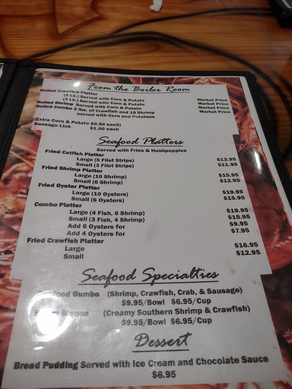 Printed menu with burgers, po'boys, and appetizers.