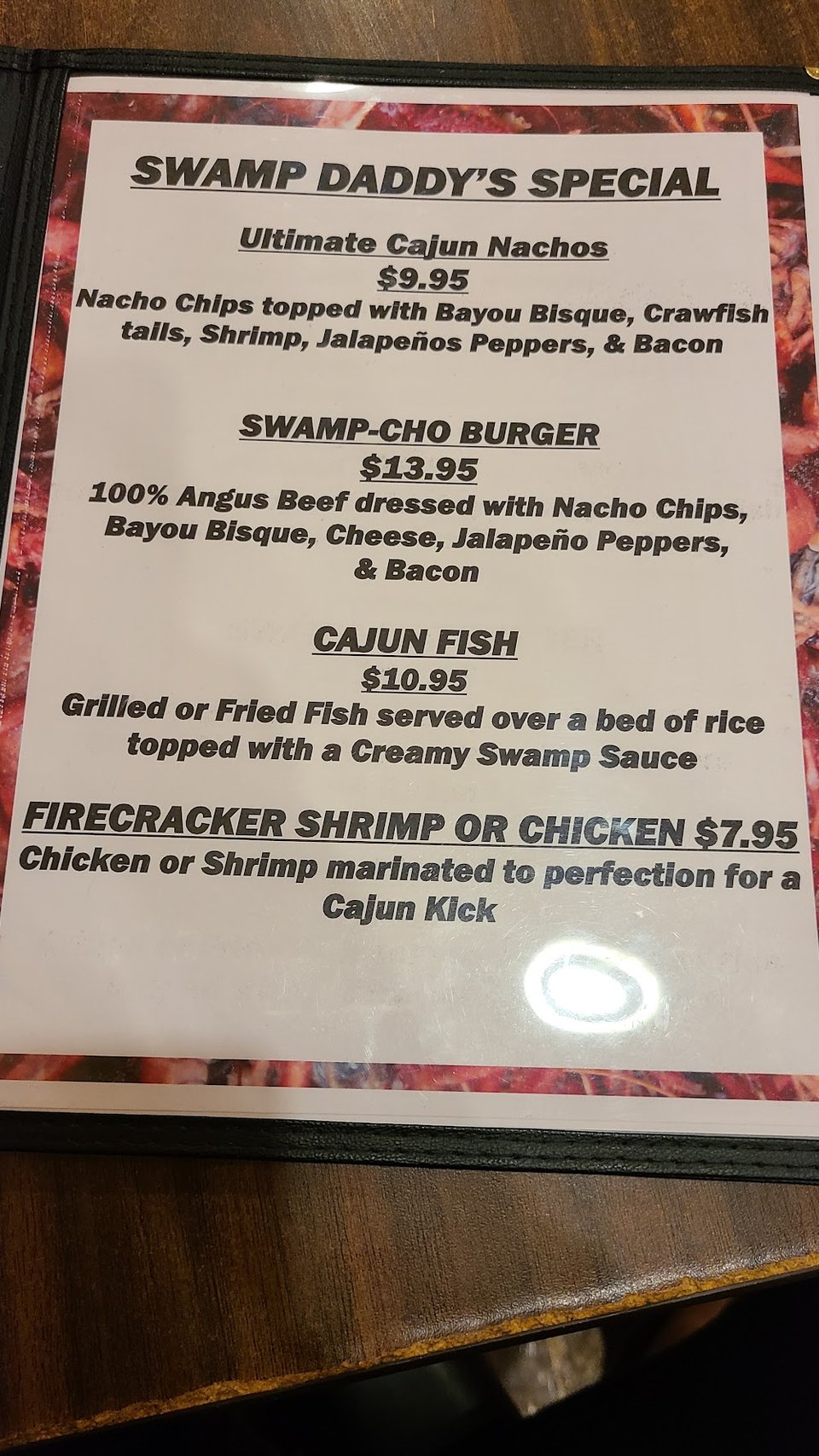 Casual restaurant menu beside a simple table.